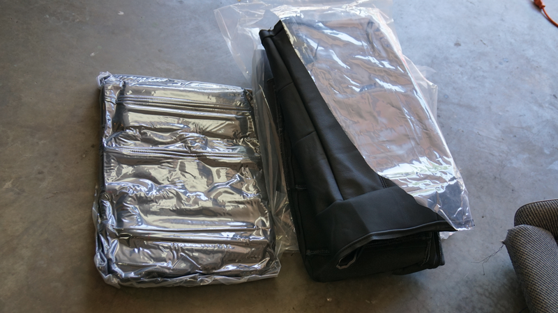 The vacuum sealed new leather seat covers.